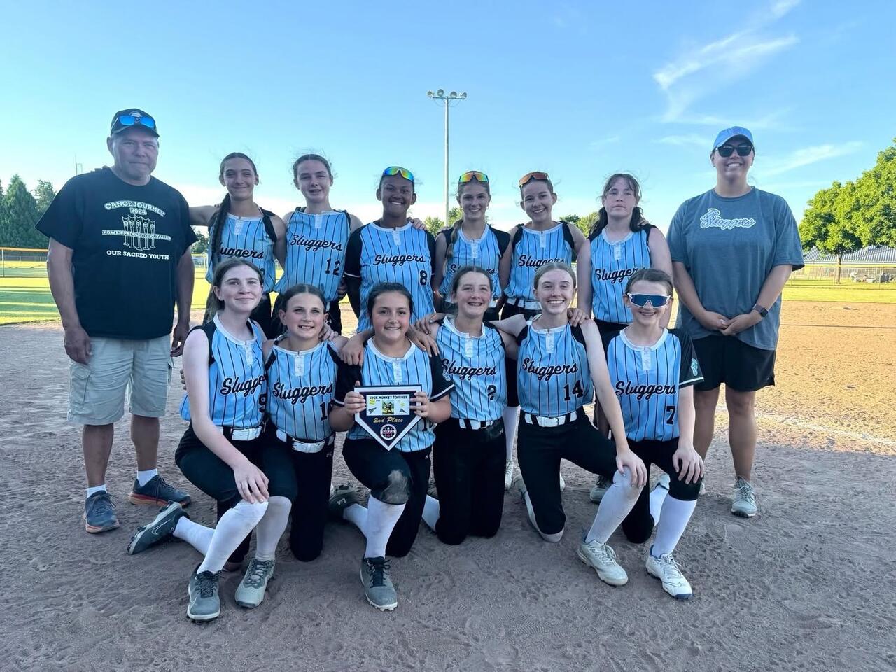 Salem Sluggers players and coaches together at the field