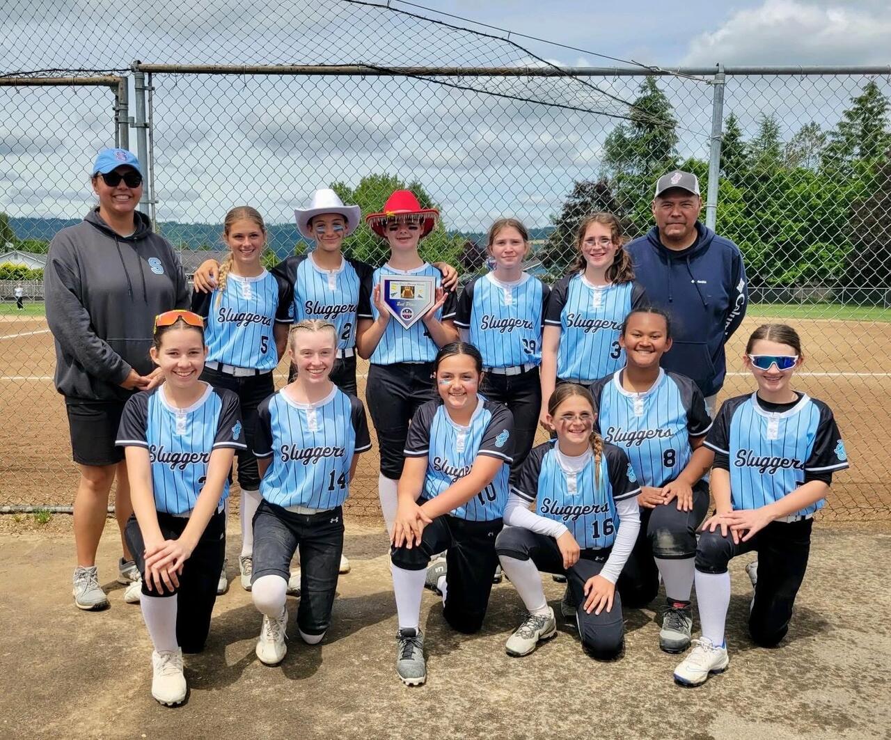 Salem Sluggers players and coaches celebrating at a tournament